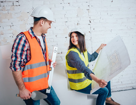 Happy couple making repairs to their home.