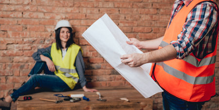 Happy couple making repairs to their home.