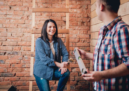 Happy couple making repairs to their home.の写真素材