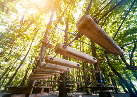 Rope park in a forest. Adventure summer park.の写真素材