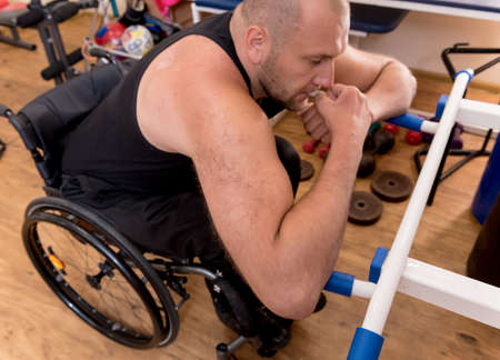 Disabled man training in the gym. Rehabilitation centerの写真素材