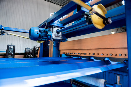 Metal sheet forming machine at the modern metalwork factory.