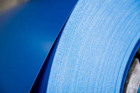 Curved lines of rolled metal are made of sheet steel.の写真素材