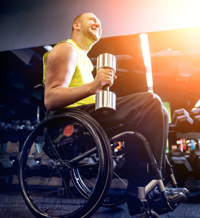 Disabled man training in the gym of rehabilitation center