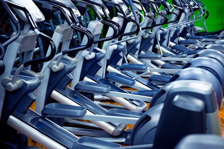 Modern gym interior with new cardio equipment.