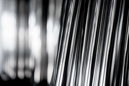 Abstract background of steel pipes stacked on a palletの写真素材