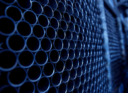 Abstract background of steel pipes stacked on a palletの写真素材