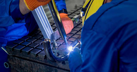 Welder working in a steel factory with argon weldingの写真素材