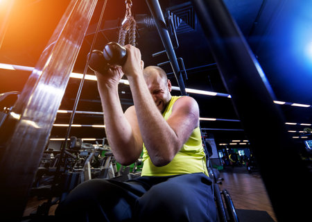 Disabled man training in the gym of rehabilitation center