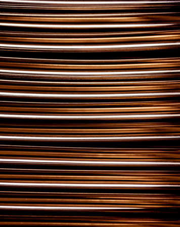 Abstract background of steel pipes stacked on a palletの写真素材