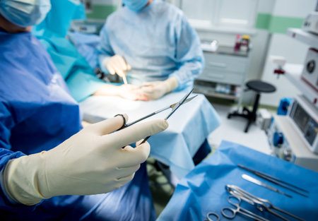 Surgeons in the operating room trying to save the patients hand.