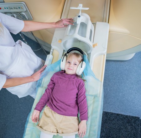 Radiologist prepares the little girl for an MRI brain examination