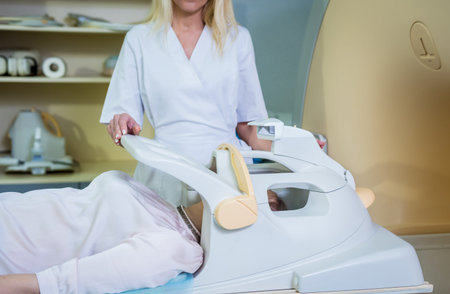 Radiologist prepares the young woman for an MRI brain examination