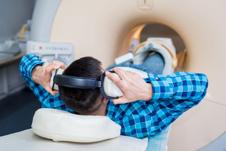 Radiologist prepares the patient for an MRI knee examination