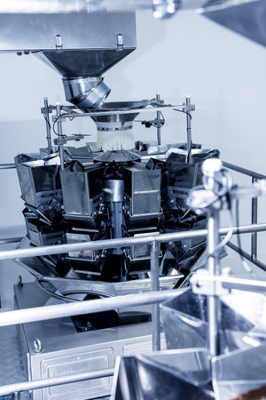 Vertical multi-head weigher packaging machine snacks and chips in a factoryの写真素材