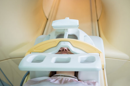 Radiologist prepares the young woman for an MRI brain examination