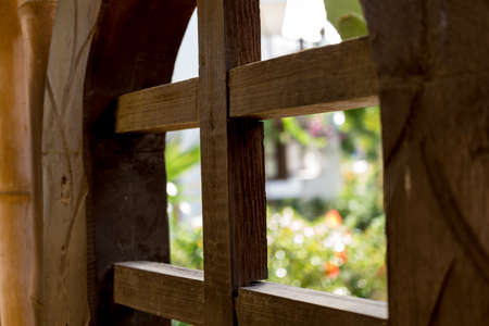 Old wooden doors at the beautiful tropical gardenの写真素材