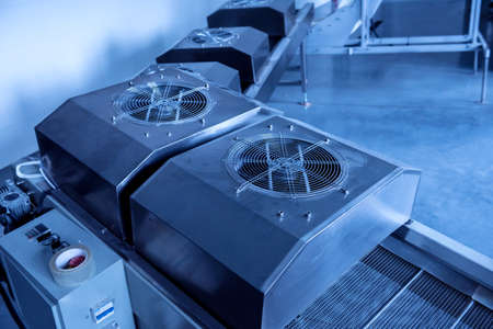 Conveyor line for frying snacks and chips in a modern factoryの写真素材