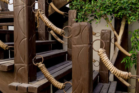 Old rustic wooden stairs in the gardenの写真素材