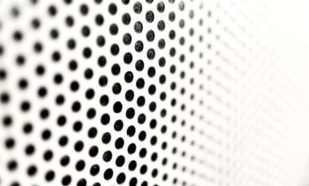 Background sheet of metal with circular holesの写真素材