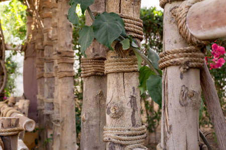 Bamboo poles tied by a thick ropeの写真素材