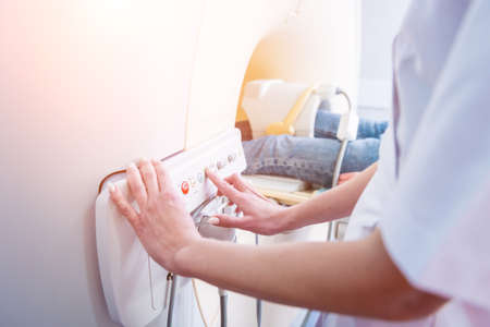 Radiologist prepares the patient for an MRI knee examinationの写真素材