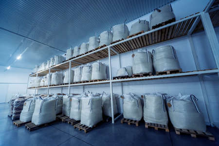 Stacking of wheat bags in the modern warehouseの写真素材