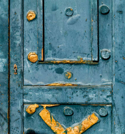 Fragment of old door with cracked paintの写真素材