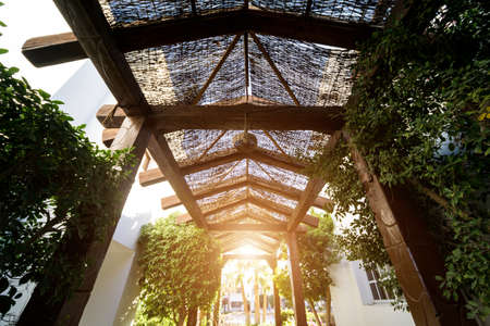 Old wooden roof at the beautiful tropical gardenの写真素材