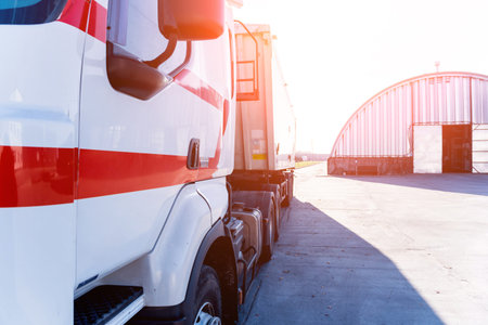 Big truck standing near the gate of the warehouse