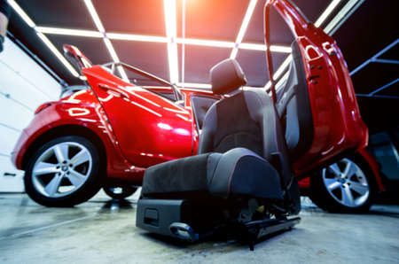 Car service worker disassemble the interior of the carの写真素材