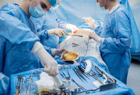Breast augmentation under the guidance surgeons team in surgical operating room.の写真素材
