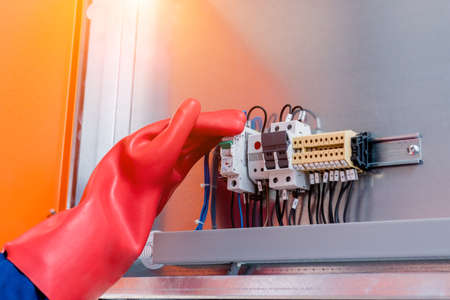 The engineer checks the absence of induced voltage on the high voltage cellsの写真素材