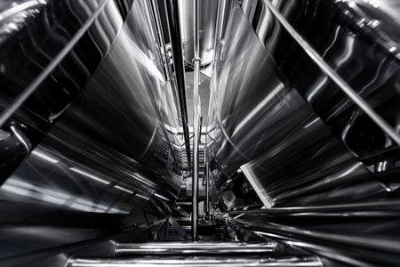 Rows of steel tanks for beer fermentation and maturation in a craft breweryの写真素材