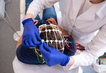 Patient brain testing using encephalography at medical centerの写真素材