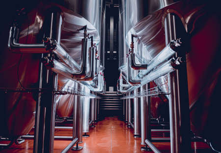 Rows of steel tanks for beer fermentation and maturation in a craft breweryの写真素材
