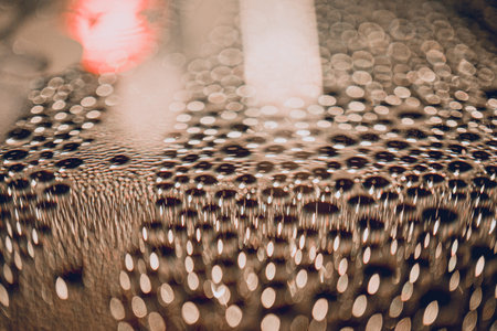Many different drops of water on the metal surface