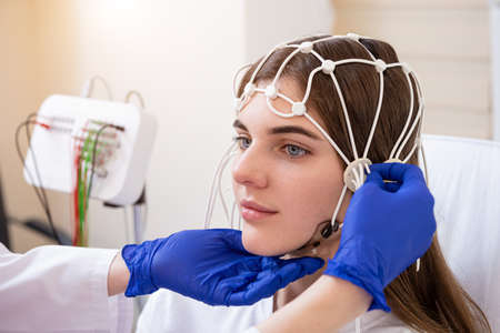 Patient brain testing using encephalography at medical centerの写真素材