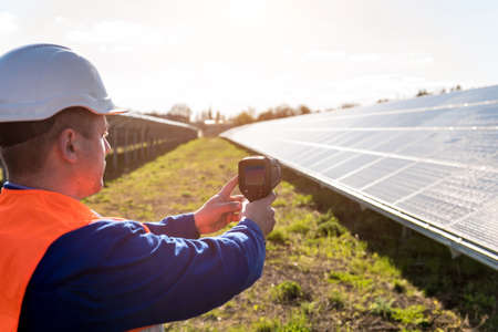 Inspector examination of photovoltaic modules using a thermal imaging cameraの写真素材