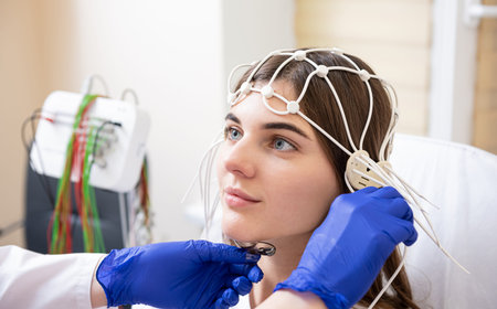 Patient brain testing using encephalography at medical center