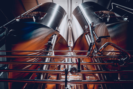 Rows of steel tanks for beer fermentation and maturation in a craft brewery