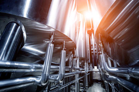 Rows of steel tanks for beer fermentation and maturation in a craft breweryの写真素材