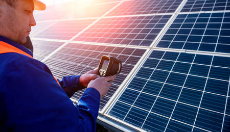 Inspector examination of photovoltaic modules using a thermal imaging cameraの写真素材