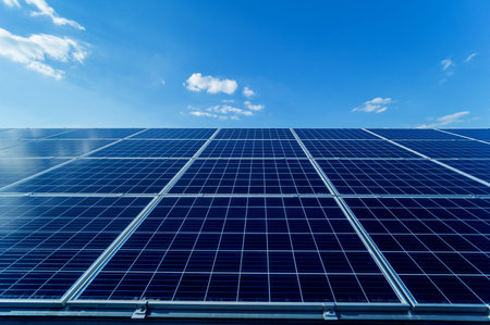 Photovoltaic solar panels on blue sky background