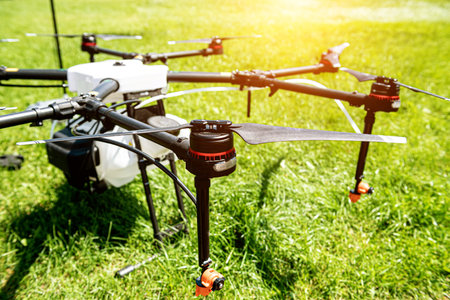Professional agriculture drone on the green field