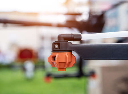 Professional agriculture drone on the green fieldの写真素材