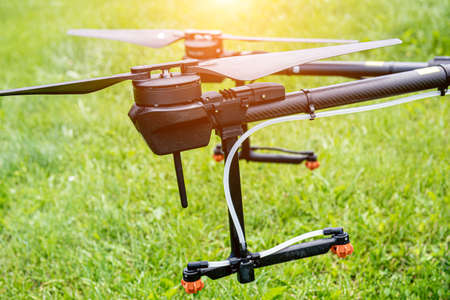 Professional agriculture drone on the green fieldの写真素材