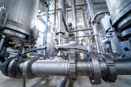 Modern interior of a beverage plant with barrels and pipesの写真素材