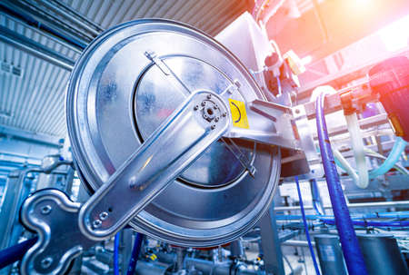 Modern interior of a beverage plant with barrels and pipesの写真素材