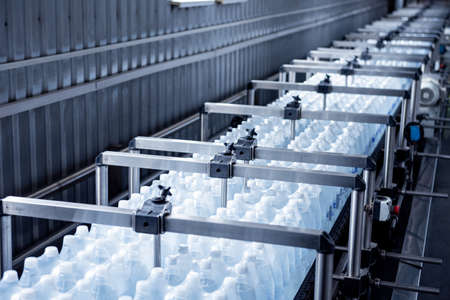 Modern strapping and transporting machine for packaging line at beverage plant.の写真素材